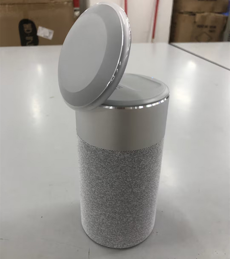 gray cylindrical iPhone charger with flip up charging pad and fabric body 3 in 1 wireless charger for iPhone and AirPods