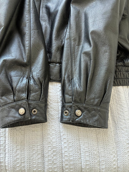Original photograph of Danier jacket cuffs showing snap fasteners and surface wear