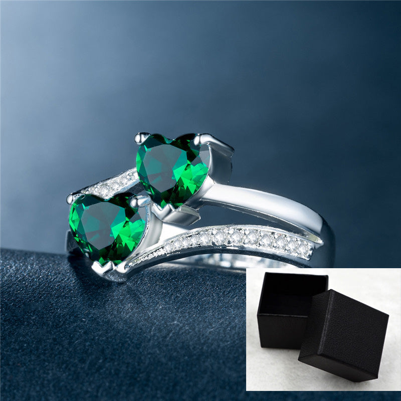 affordable luxury rings for women with green heart-shaped gemstones and silver band