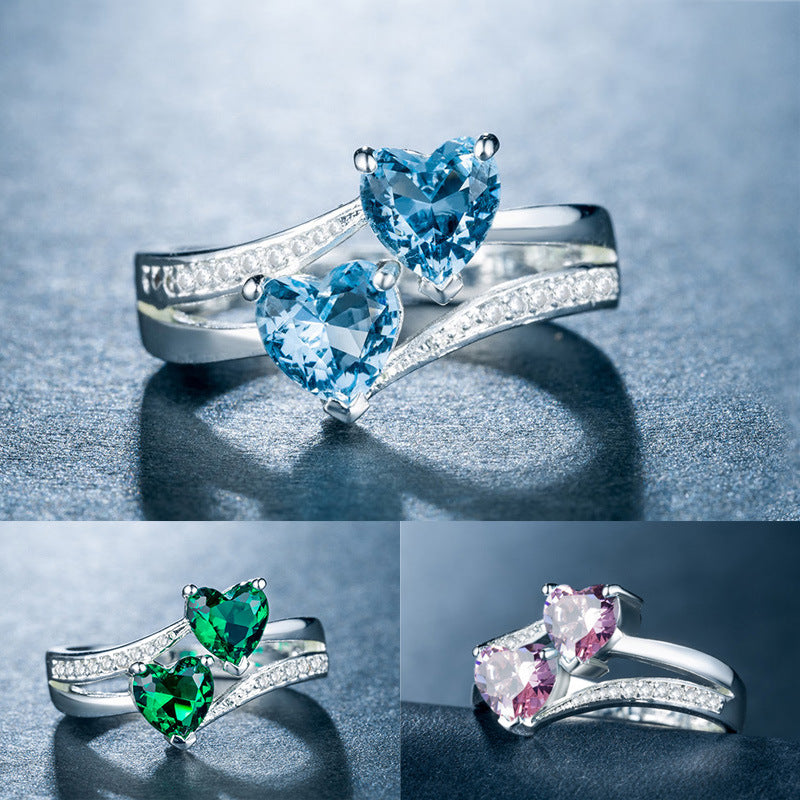 affordable luxury rings for women featuring heart-shaped blue, green, and pink gemstones with silver bands