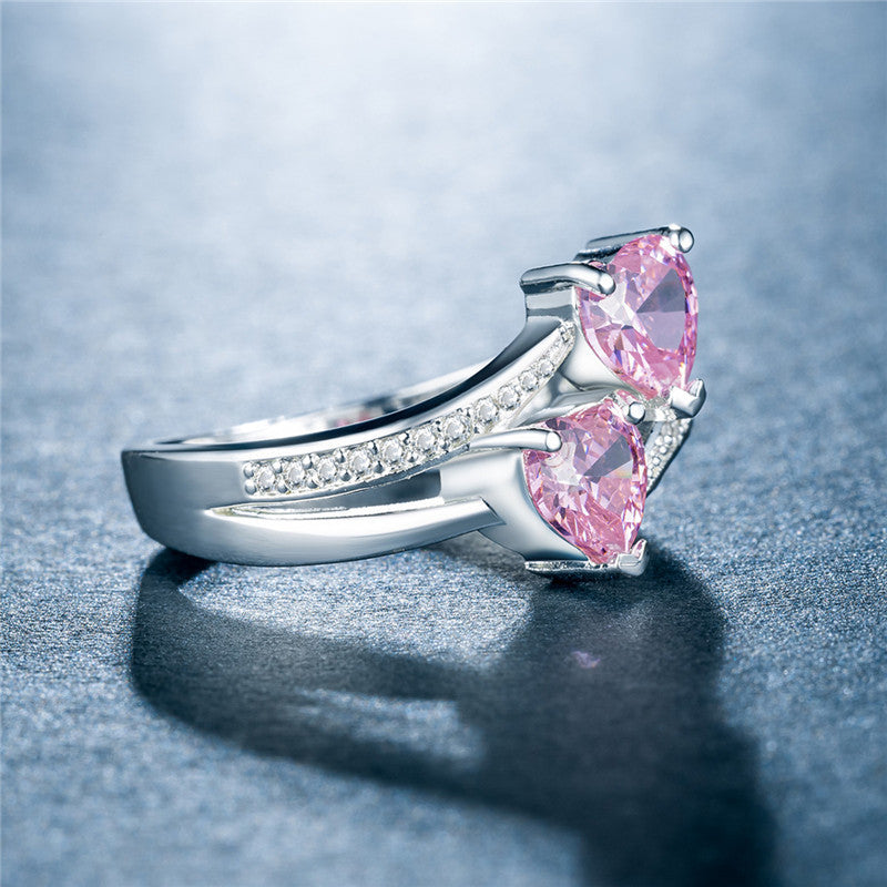 affordable luxury rings for women with pink heart-shaped stones and small clear crystals