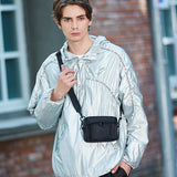 affordable men's phone case bag in black worn crossbody with adjustable strap