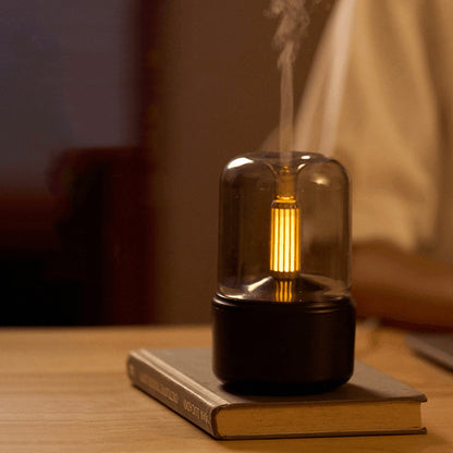 120ml LED nightlight humidifier on a book emitting warm glow and mist for bedside bedroom use