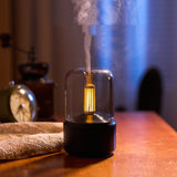 120ml LED nightlight humidifier with glass dome and warm filament LED emitting mist on bedside table