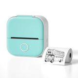 Bluetooth mini thermal label printer in teal with a printed label showing a bus design