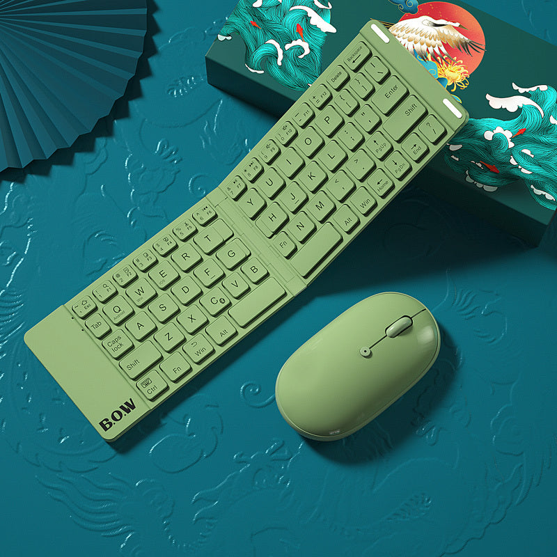 compact folding Bluetooth keyboard and mouse in green on a decorative background