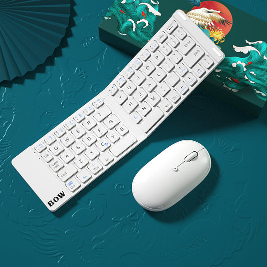 Compact folding Bluetooth keyboard and mouse in white with a stylish background