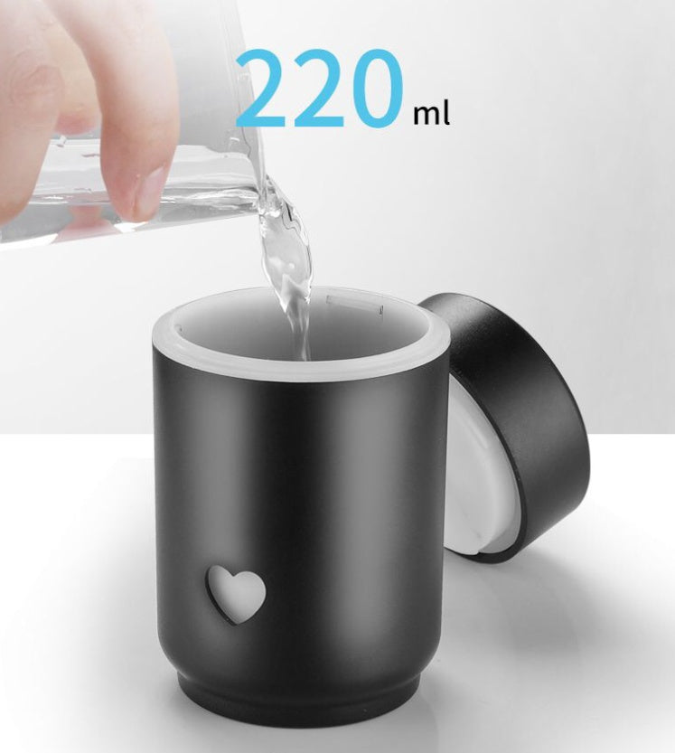 Compact car air purifier in black with a stylish design, featuring a 220ml water capacity