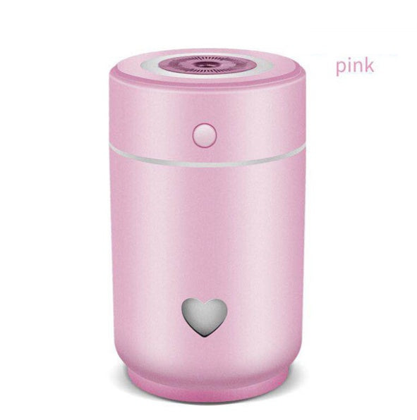 Pink compact car air purifier with a heart-shaped design for clean, fresh air in vehicles