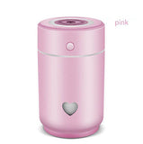 Pink compact car air purifier with a heart-shaped design for clean, fresh air in vehicles