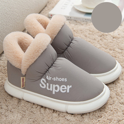 winter slippers in gray with white soles and cozy house slippers with fur lining on beige carpet