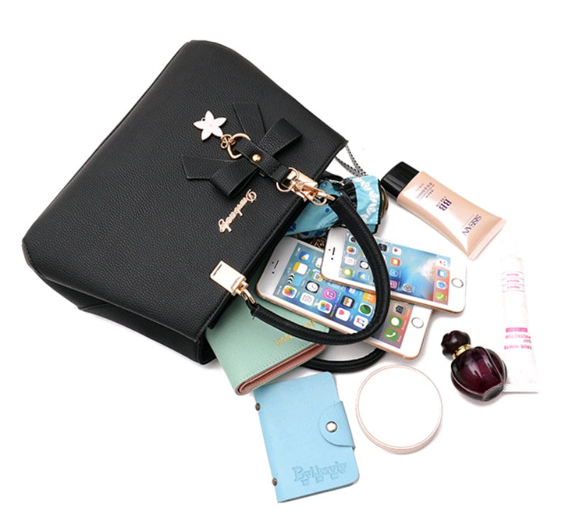 Elegant black laptop messenger bag for women with accessories and phone inside