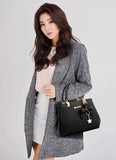 Stylish black laptop messenger bag for women with trendy bow detail and gold accents