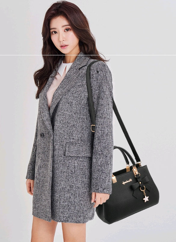 Stylish business outfit featuring a laptop messenger bag for women, perfect for professional settings
