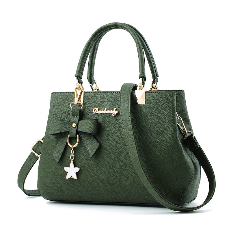 Stylish green laptop messenger bag for women with bow and star charm for everyday use