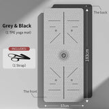 Eco-friendly yoga mat for women in grey and black with alignment guides and included strap