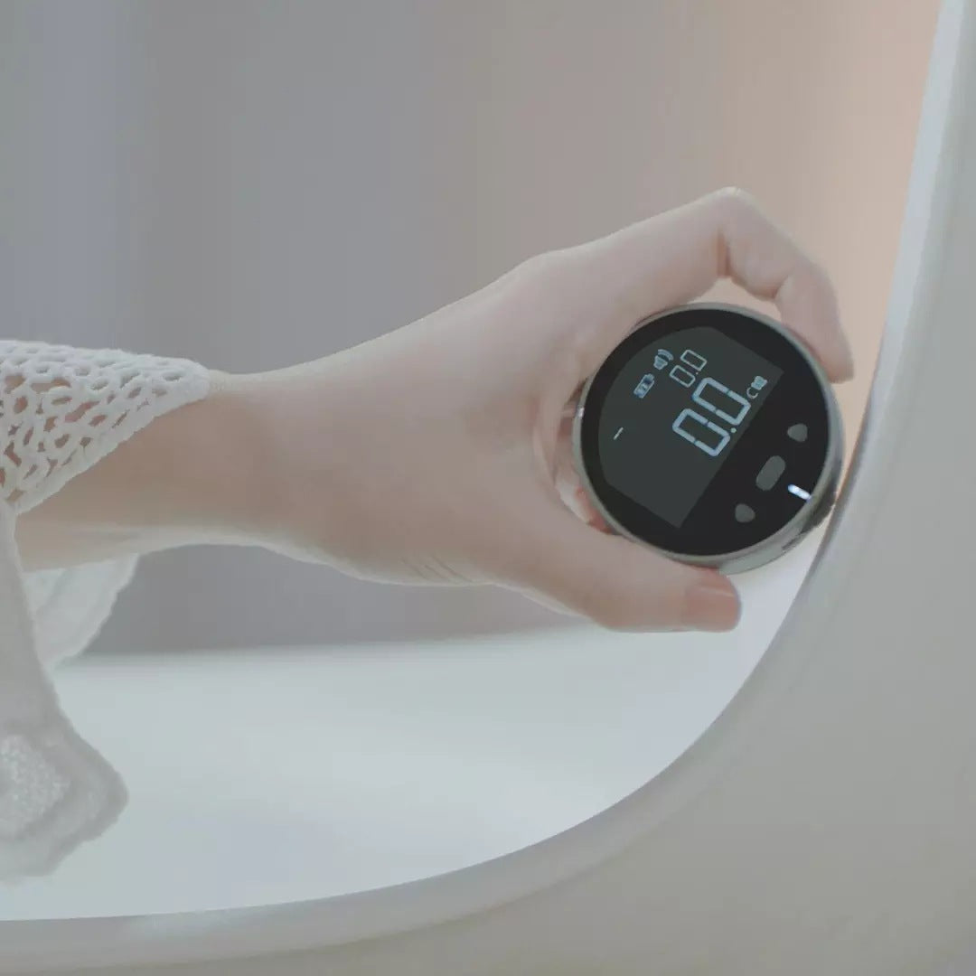 digital tape measure held in hand showing 0.0 cm on display high precision electronic ruler