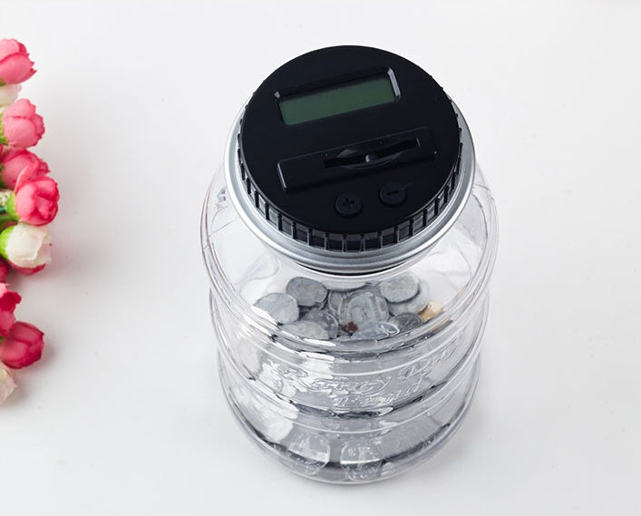 Transparent electronic coin counter jar with digital display and slot for easy coin counting