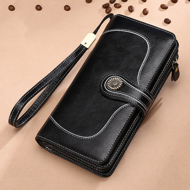 StoreFour elegant leather wallet for women mobile phone case in black with wrist strap and decorative stitching