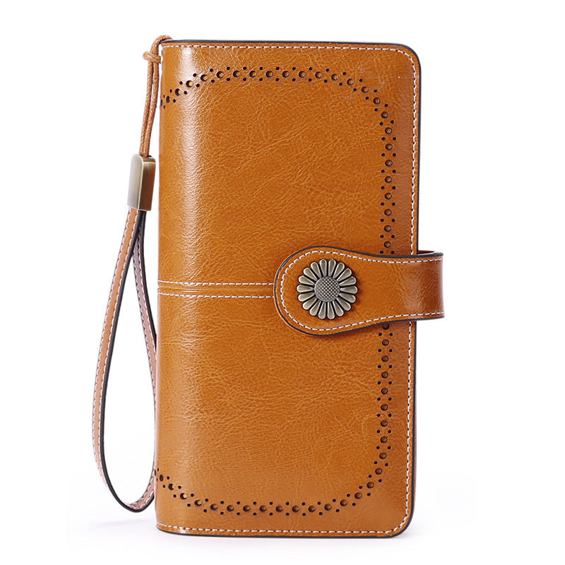 StoreFour elegant leather wallet for women in brown with decorative stitching and wrist strap