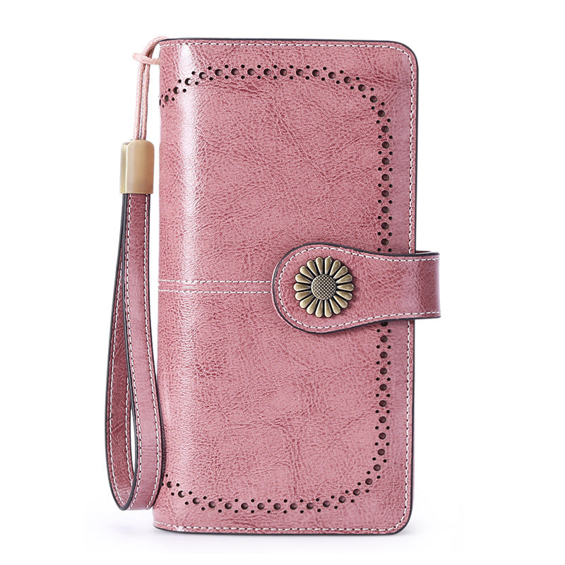 Elegant leather wallet for women mobile phone case in pink with floral clasp and wrist strap