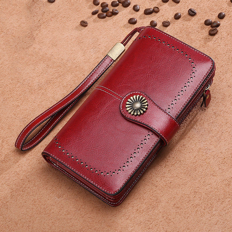 StoreFour elegant leather wallet for women in red with wrist strap and decorative button closure