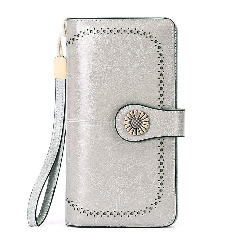 Elegant leather wallet for women mobile phone case by StoreFour with wrist strap and decorative button closure