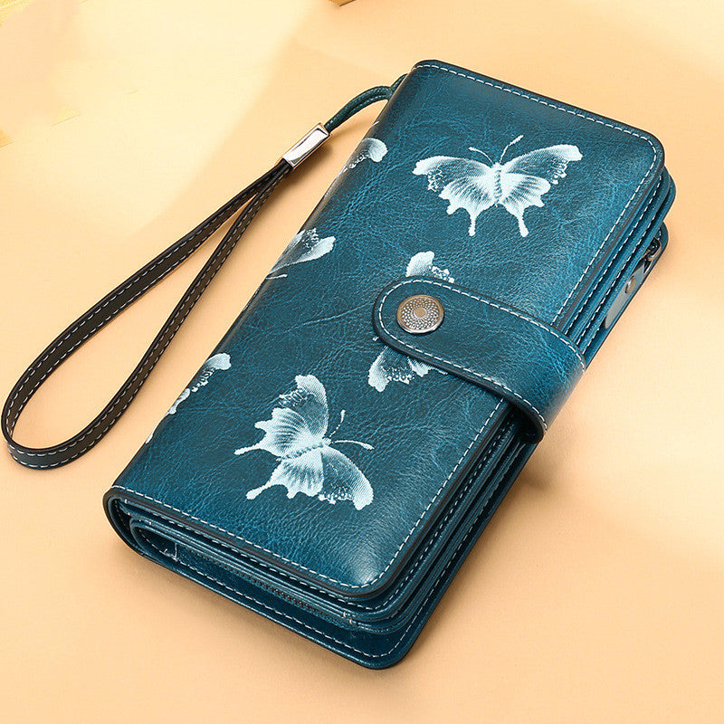 StoreFour elegant leather wallet for women mobile phone case in blue with white butterfly design and wrist strap