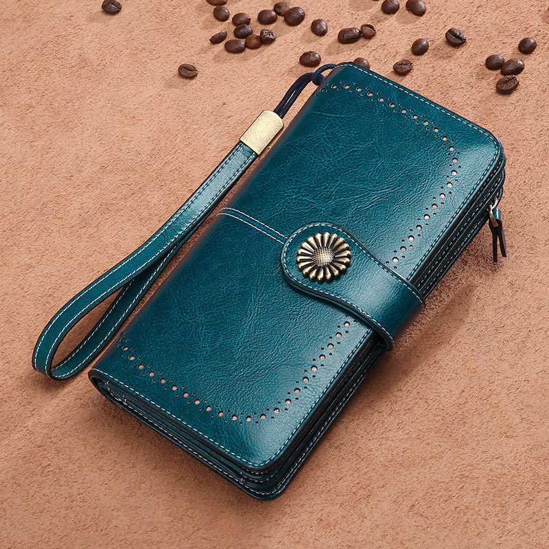StoreFour elegant leather wallet for women in teal blue with wrist strap and decorative button closure