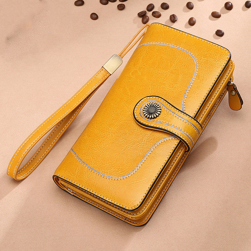 StoreFour elegant leather wallet for women in yellow with wrist strap and button closure