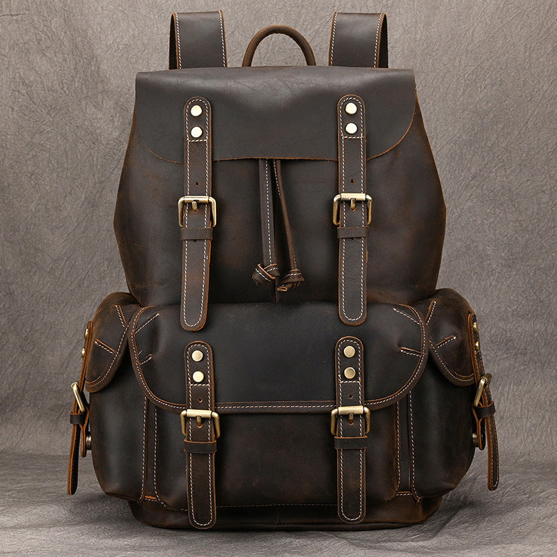 First-layer cowhide adventure backpack with multiple pockets and stylish vintage design