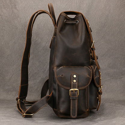 Stylish first-layer cowhide adventure backpack with multiple pockets and adjustable straps