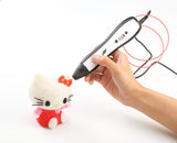 Child using four-colour 3D printing drawing pens for kids to decorate a plush Hello Kitty toy