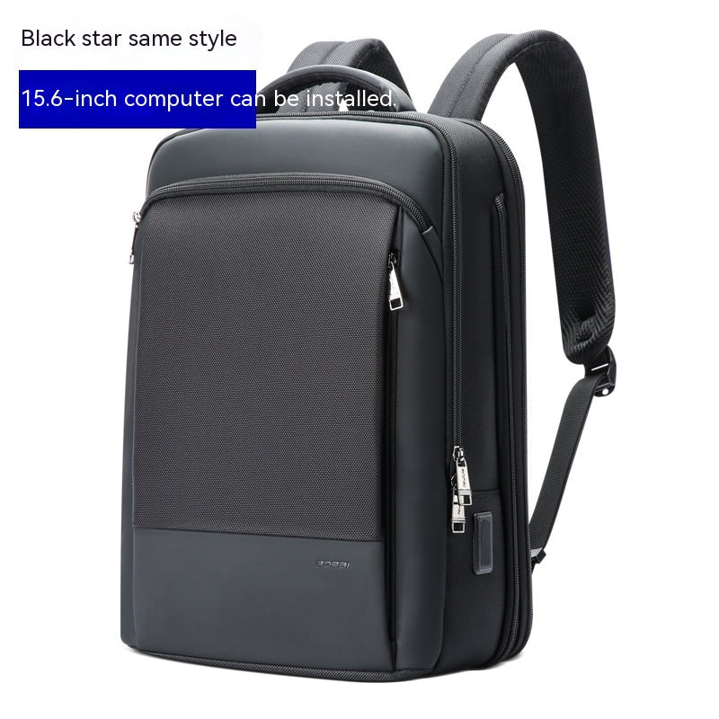 mens 15.6 inch waterproof backpack with USB ports in black padded straps and laptop compartment