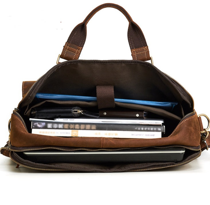 Interior view of a 15.6-inch genuine cowhide leather business bag with compartments for documents and a laptop