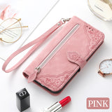 Pink Google Pixel 7 zipper wallet case with wrist strap and floral design for stylish protection