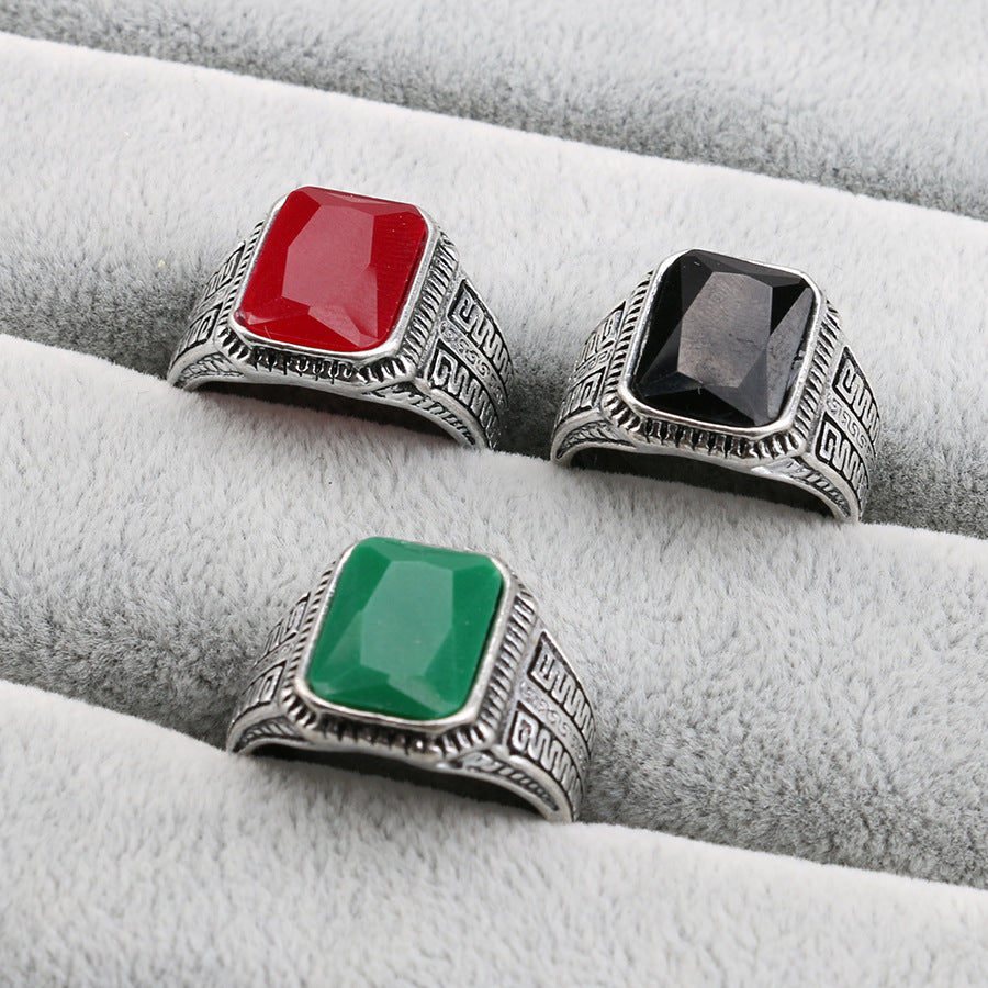 CJD vintage men's ring with semi-precious stone trio of silver rings with red black and green rectangular stones on gray display