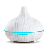 550ml ultrasonic humidifier in a wood grain design for adding moisture to the air