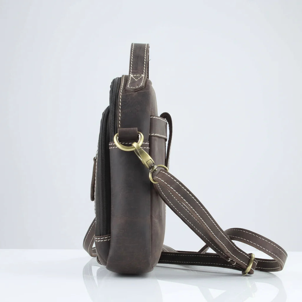 Side view of Hunter genuine leather crossbody bag featuring a sturdy strap and smooth texture