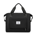 black compact work backpack for women with top handles front zip pocket and bottom compartment
