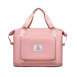 pink nylon compact work backpack for women with top handles front pocket and zippered base compartment