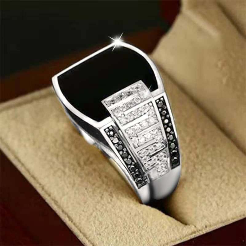 men's elegant black gemstone ring set in silver with intricate detailing and sparkling accents