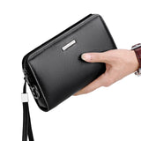 men's leather clutch wallet in black with zip closure and wrist strap for stylish storage