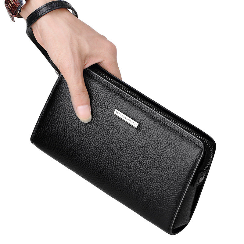 Men's leather clutch wallet in black with a sleek design and zippered closure for convenience.