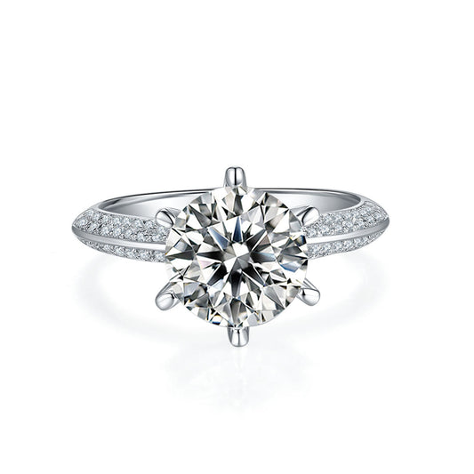 CJD sparkling moissanite diamond engagement ring with detailed side stones on a silver band