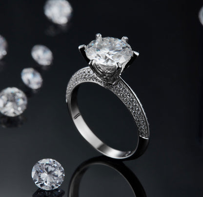 moissanite diamond engagement ring with a large center stone and paved band detailing