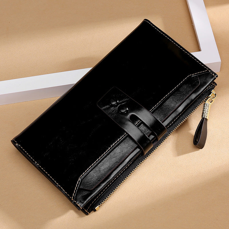 oil-waxed leather card holder in black with a zip-around closure for secure storage
