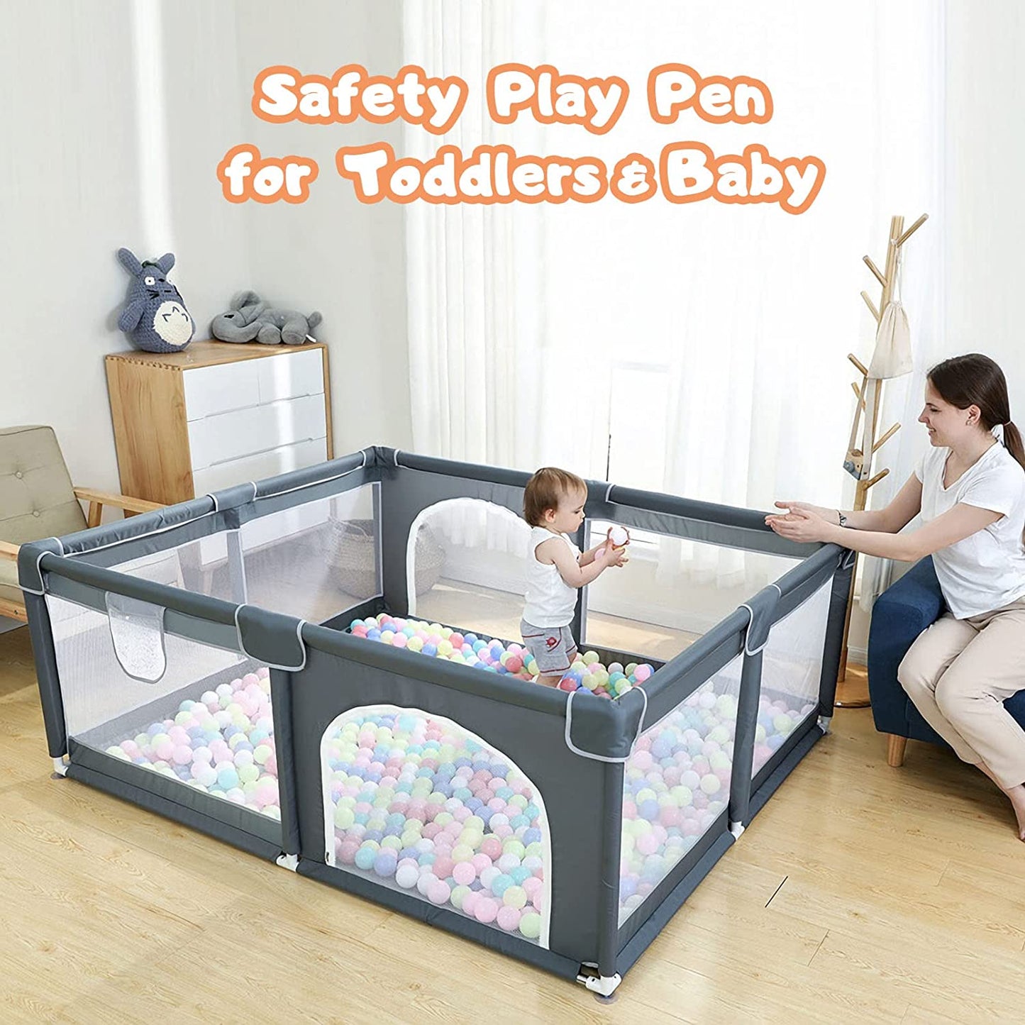 Gray mesh CJD playpen with pastel ball pit and toddler inside supervised by parent gated playpen for babies and toddlers