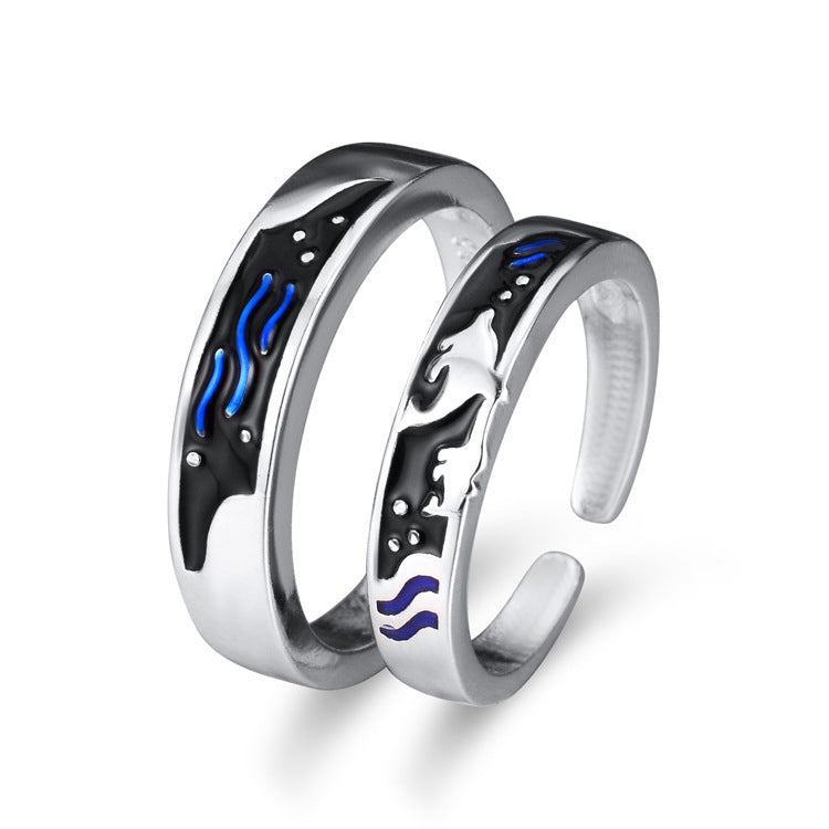 sea-themed matching rings for couples with ocean wave and dolphin designs
