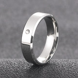Sleek silver couple ring featuring a single stone accent for a modern touch